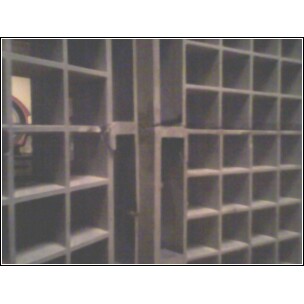 1972 Ford Ranchero - A metal shelving unit with numerous square compartments is shown.