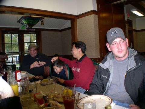 2007 Toyota FJ Cruiser - A group of people are gathered around a table in a restaurant.