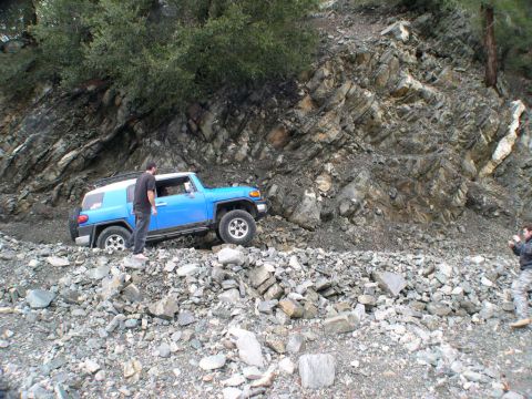 2007 Toyota FJ Cruiser - Blue 2007 Toyota FJ Cruiser on a challenging rocky off-road path.