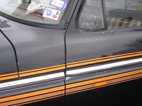 1979 Ford F-150 - This 1979 Ford F-150 features a distinctive side stripe and plaid interior upholstery.