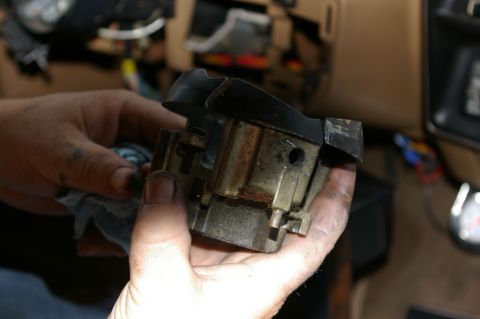 1986 Ford Bronco - A close-up view of a removed ignition switch assembly, showing its internal mechanical components.