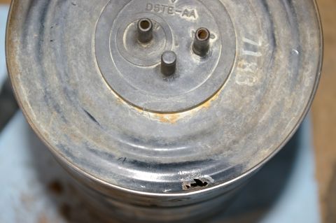 1986 Ford Bronco - Close-up of a metal part with visible part numbers and signs of wear.