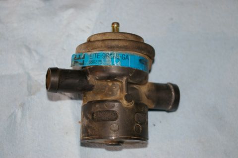 1986 Ford Bronco - This vacuum control valve has a blue label with part number E1TE-9R275-GA and 68032S visible.