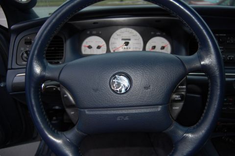 1985 Mercury Grand Marquis - The interior of a 2003 Mercury Grand Marquis, its distinctive steering wheel and instrument cluster.