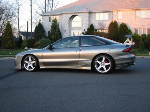 1994 Ford Probe - Silver 1994 Ford Probe parked on a street in front of a large house.