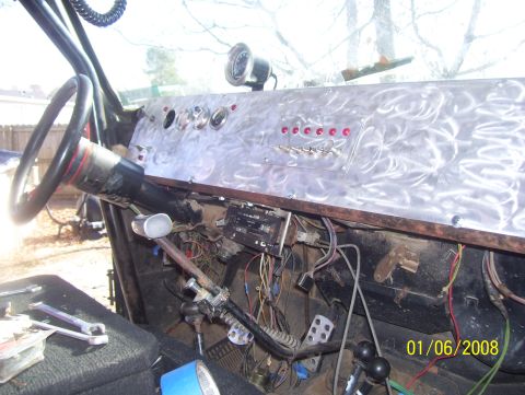 1978 Ford Bronco - Interior view of a vehicle's custom dashboard with aftermarket gauges and switches.