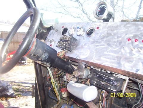 1978 Ford Bronco - Interior view of a vehicle's dashboard with custom modifications and extensive wiring.