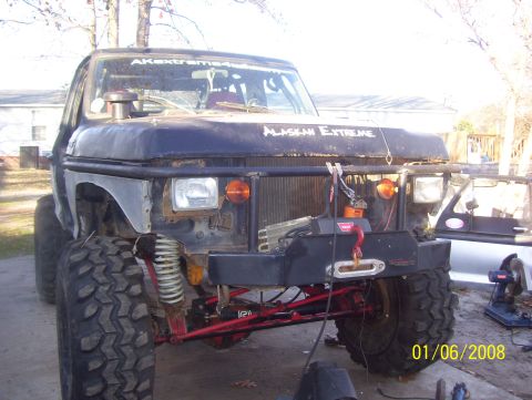 1978 Ford Bronco - This heavily modified off-road vehicle features a prominent winch and large tires, suggesting extensive off-road use.