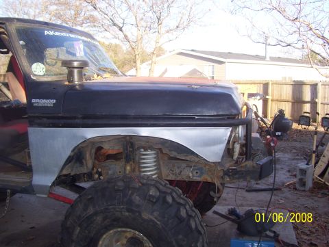 1978 Ford Bronco - Front fender and hood section of a 1978 Ford Bronco, showing custom modifications and snorkel.