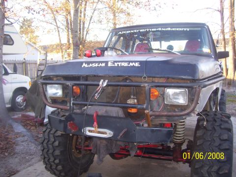 1978 Ford Bronco - This modified truck features a custom bumper, large tires, and off-road lighting, with "ALASKAN EXTREME" visible on the hood.