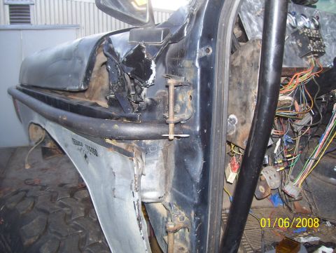 1978 Ford Bronco - The interior of a vehicle shows significant damage, exposed wiring, and a roll cage, with a date stamp of 01/06/2008.
