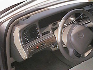 1998 Mercury Grand Marquis - Dash showing LPG swith (black left hand side nearest door.) Rear fog light switch is red switch in between that and rear demist switch.