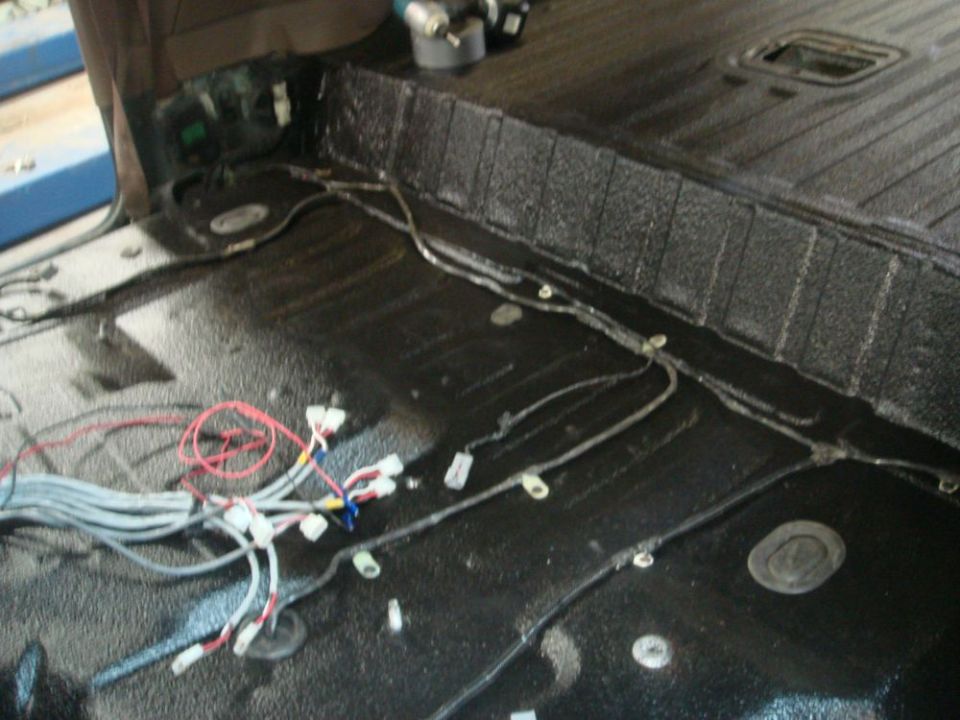Interior wiring harness with black textured flooring