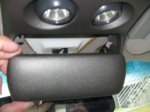 1994 Chevrolet Silverado 3500 - Removing the sunglasses holder from the overhead console.