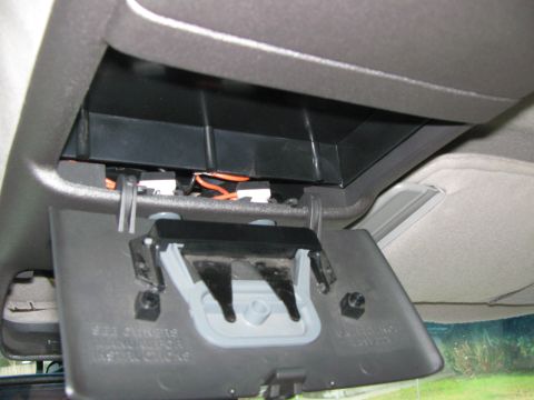 1994 Chevrolet Silverado 3500 - The open overhead console compartment reveals wiring and the internal latch mechanism.