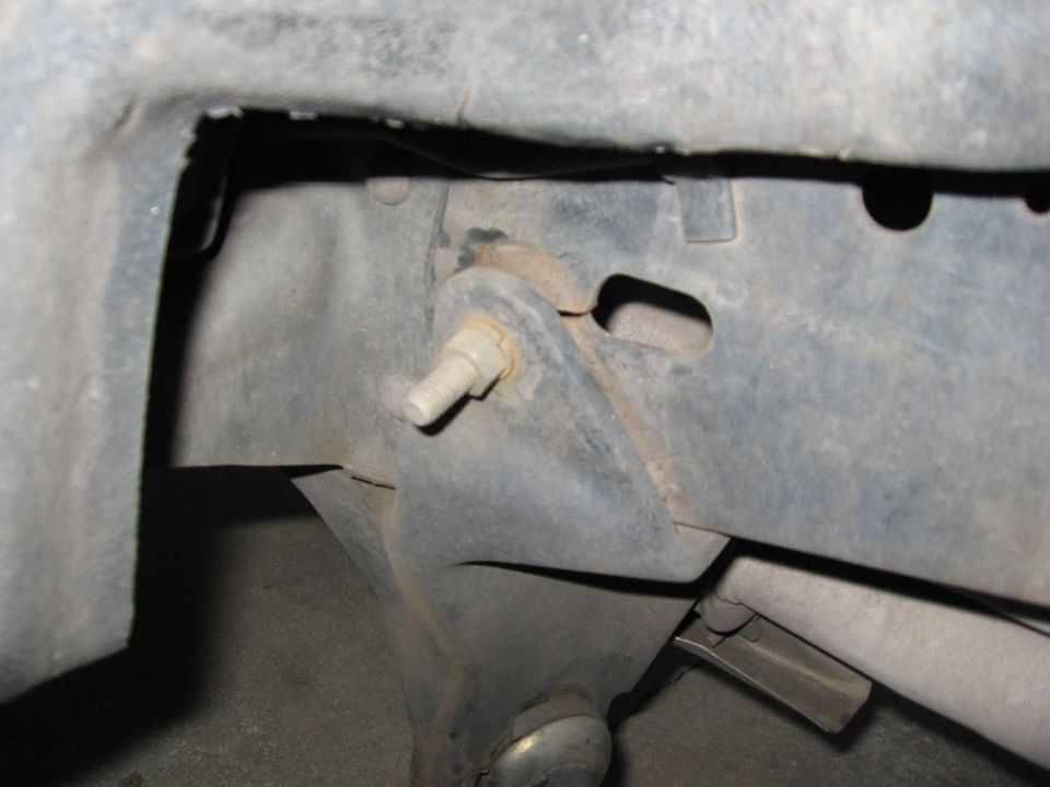 Close-up of a frame tear with a bolt visible