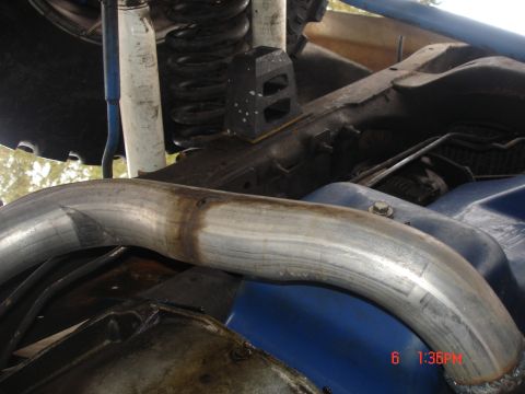 1979 Ford Bronco - Undercarriage view showing exhaust piping and suspension parts.