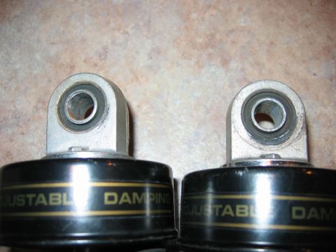 1985 Ford LTD Crown Victoria - Close-up view of two adjustable damping shock absorbers, likely aftermarket parts.