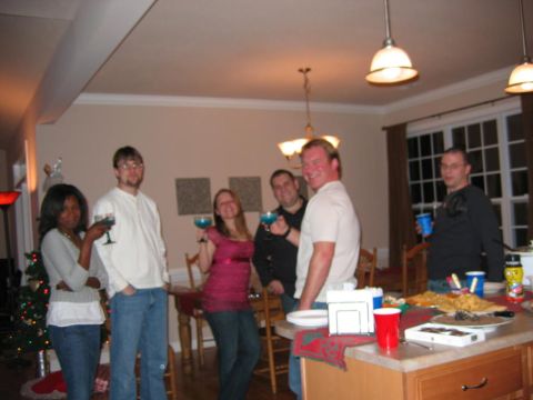 1985 Ford LTD Crown Victoria - A group of friends gather for a celebration, holding blue drinks and smiling.
