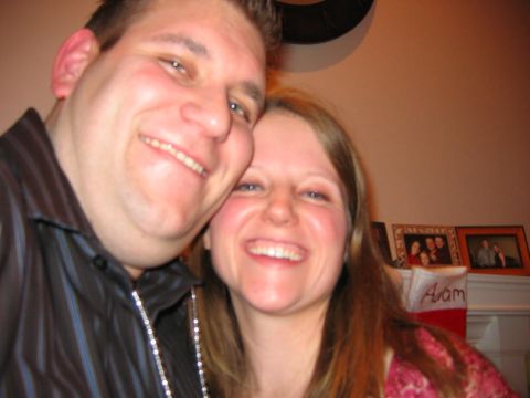 1985 Ford LTD Crown Victoria - A couple smiles for a selfie during a holiday gathering.