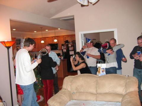 1985 Ford LTD Crown Victoria - A group of friends gather for a New Year's Eve celebration, complete with party hats and drinks.