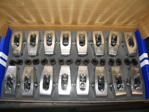 1979 Ford F-150 - A new set of performance engine rocker arms and hardware are neatly arranged in a cardboard box.