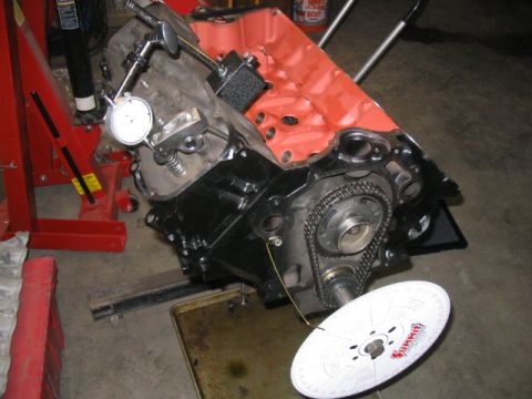 1979 Ford F-150 - Engine block assembly with measurement tools, including a dial indicator and a Summit Racing timing wheel.