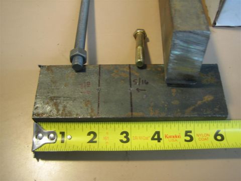 1987 Suzuki Samurai - A metal bracket is measured with a tape measure, showing a 5/16 inch marking.