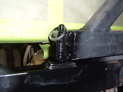 1978 Ford Bronco - A detail shot focuses on the tow hitch assembly and part of the vehicle's frame, showing recent work.