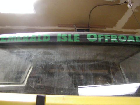 1978 Ford Bronco - Vehicle rear window displays 'EMERALD ISLE OFFROAD' text.