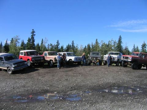 1978 Ford Bronco - Several Ford Broncos and other off-road vehicles are gathered together on a sunny day.