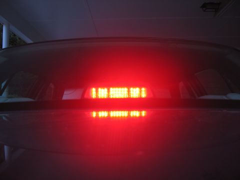 2000 Ford Crown Victoria - The rear third brake light of a 2000 Ford Crown Victoria is illuminated, showing its distinctive LED pattern.
