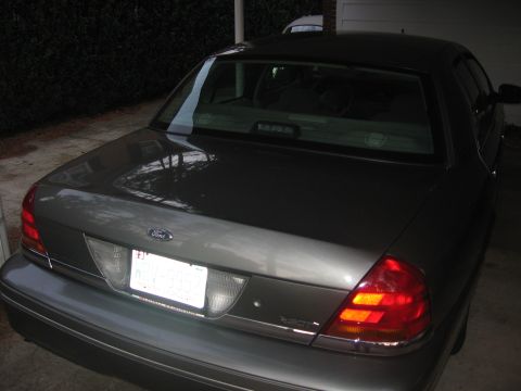 2000 Ford Crown Victoria - The rear of a 2000 Ford Crown Victoria shows its taillights and license plate.