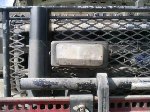 1989 Ford Bronco - Auxiliary light and grille detail on a truck, possibly modified.