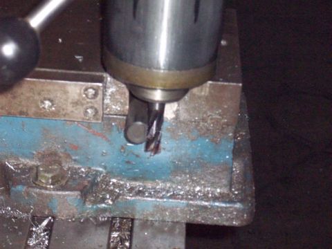 1978 Ford Bronco - Close-up of a milling machine's cutting tool in action, with metal shavings visible.