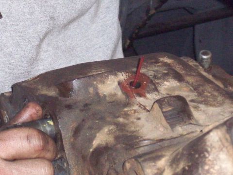 1978 Ford Bronco - Close-up view of a transfer case with red fluid visible.
