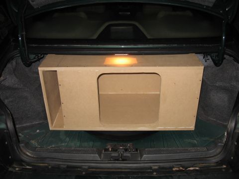 1992 Ford Crown Victoria - The trunk of a car contains a custom-built subwoofer enclosure.