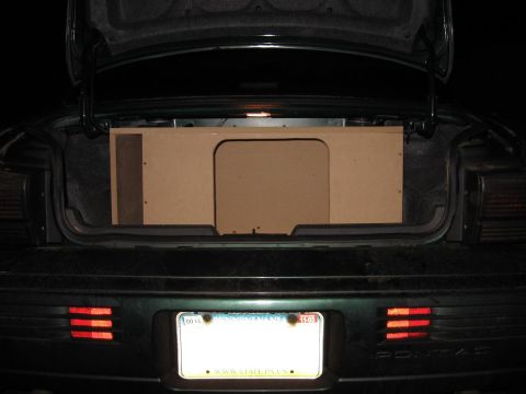 1992 Ford Crown Victoria - Custom subwoofer box installed in the trunk of a car. The rear of the vehicle is visible.