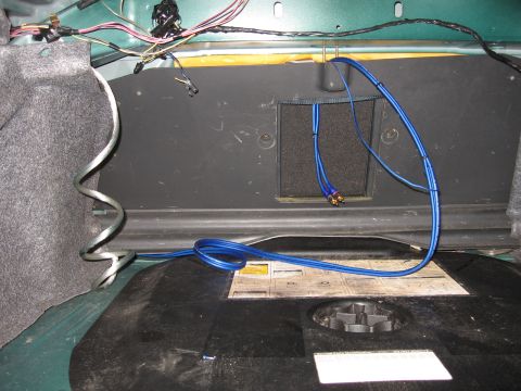 1992 Ford Crown Victoria - Wiring and audio cables are visible inside the trunk of a car.