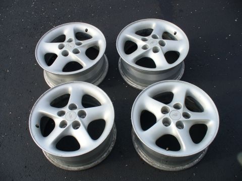 1991 Ford Probe - Set of four silver 5-spoke alloy wheels, likely aftermarket or OEM parts.