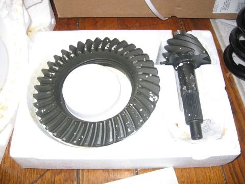 1989 Ford Bronco - A set of differential gears, including a ring gear and a pinion gear, are presented in protective foam packaging.