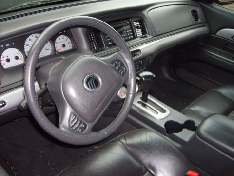 1993 Ford Crown Victoria - Interior of a car, likely a Mercury Grand Marquis or similar model, showing the driver's side controls and seating.
