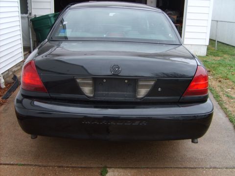 1993 Ford Crown Victoria - The rear of a black Mercury Marauder is shown, with the model name visible on the bumper.