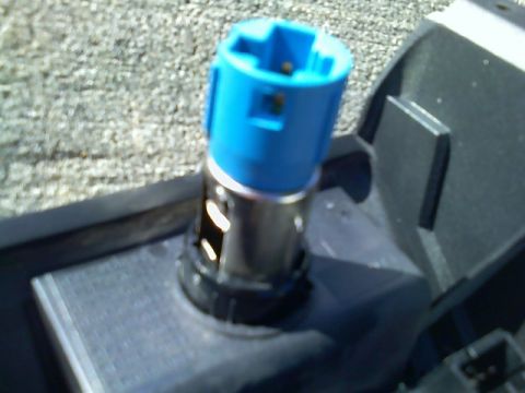 2004 Jeep Wrangler - Close-up of a cigarette lighter socket, likely from a vehicle's interior.