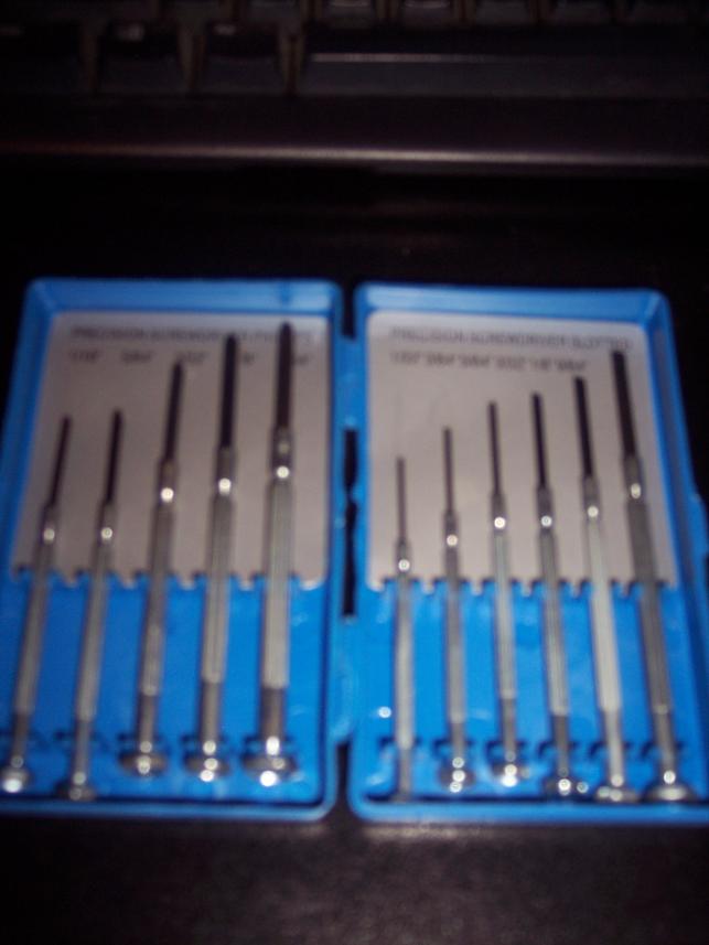 Blue case with two rows of precision screwdrivers. Text on case reads 'PRECISION SCREWDRIVER SET'