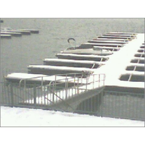 1972 Ford Ranchero - Boats are docked at a snowy marina, suggesting a cold weather scene.