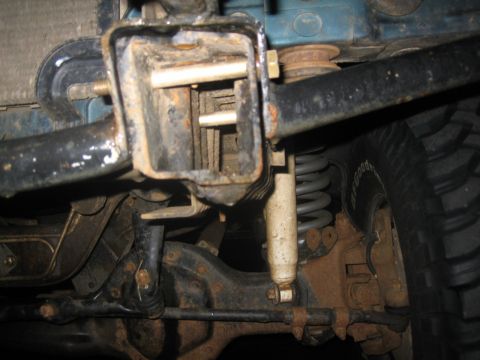 1995 Ford Bronco - Underside view of a vehicle's rear suspension and trailer hitch receiver assembly.