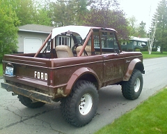 1973 Ford Bronco - This 1973 Ford Bronco is shown from a rear three-quarter view on a residential street.