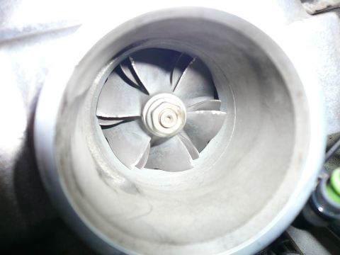 1996 Ford Probe - The compressor wheel of a turbocharger shows signs of wear and tear.