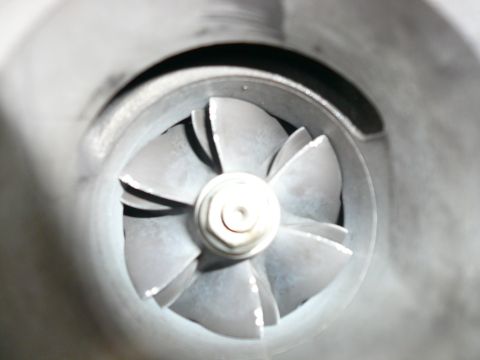 1996 Ford Probe - Close-up view of a turbocharger's compressor wheel, showing its intricate blade design.